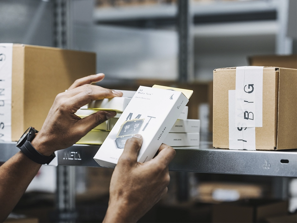 Close-up of Angelbird memory cards and camera gear